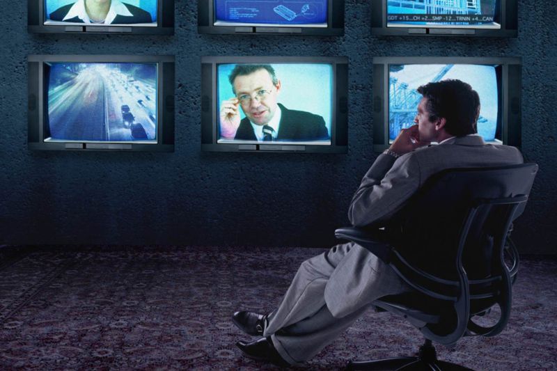 A picture of a manager watching TV