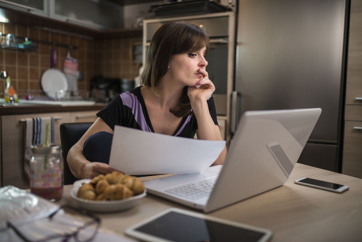 Upset woman looking at her bills