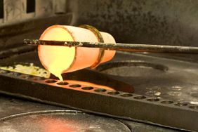 A fire assay is conducted on an ore sample at Stillwater Mining Co.'s processing plant in Columbus, Montana, U.S., on Tuesday, Aug. 12, 2008. 