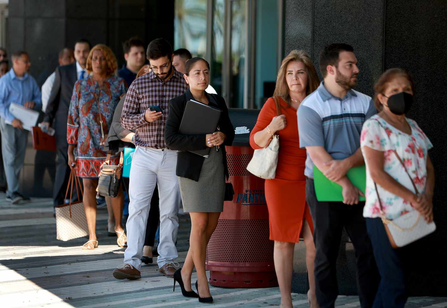 People lineup as the doors open to the Mega Job Fair held at the FLA Live Arena on June 23, 2022 in Sunrise, Florida.