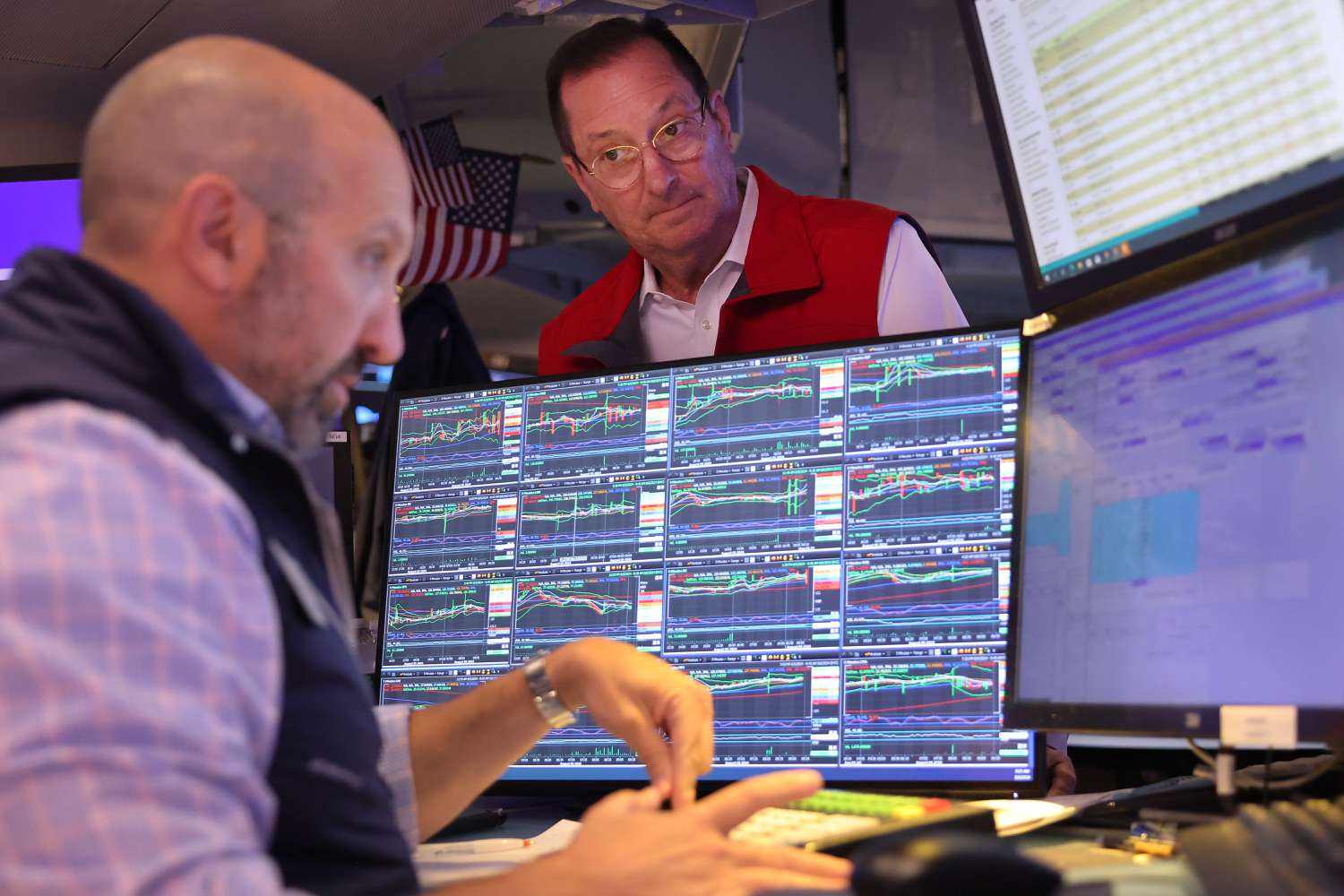Traders work on the floor of the New York Stock Exchange