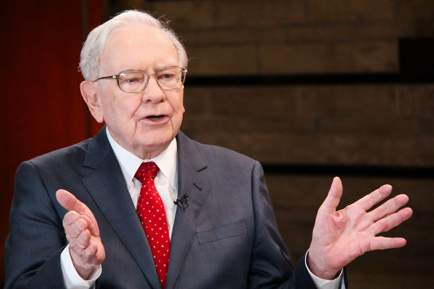 Warren Buffett gesturing while speaking