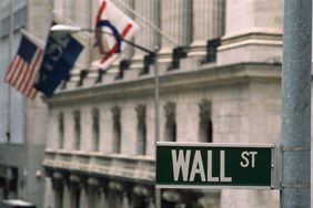 The "Wall St." street sign. 