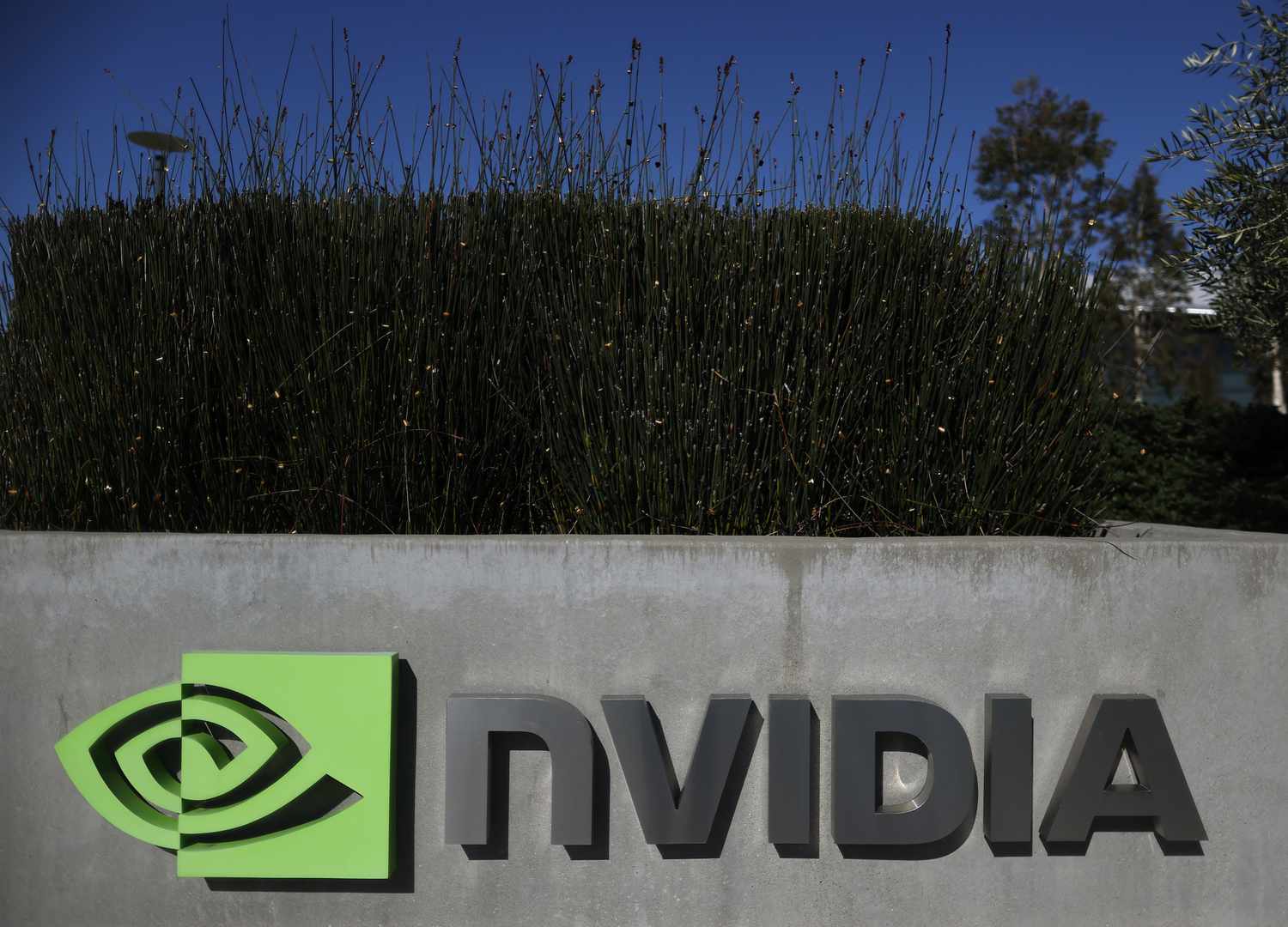 The Nvidia logo is seen on a sign outside the company's headquarters.
