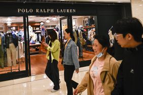 People walk past a Polo Ralph Lauren store in Beijing on May 8, 2025