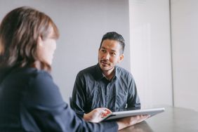 Two people in a business meeting.