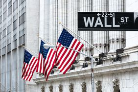 New York Stock Exchange with the Wall St street sign in front