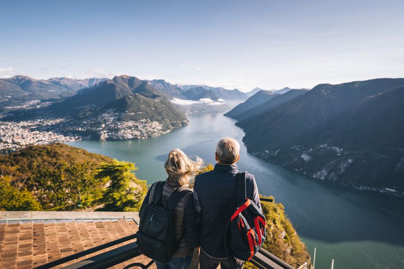 Senior couple looking over mountains and lakes