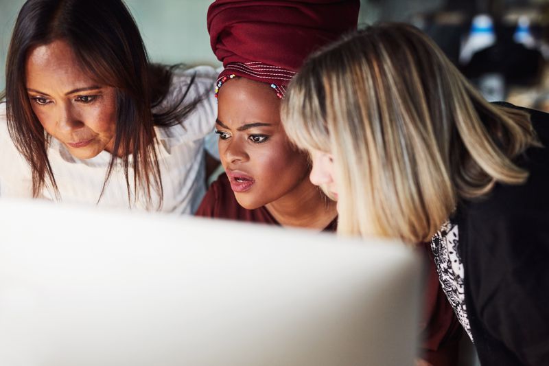 Women in discussions about their student loan debts.