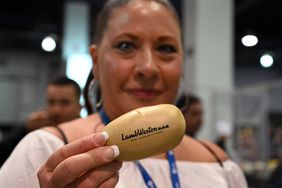 A woman holds a Lamb Weston branded action at an expo in Las Vegas in 2021. 