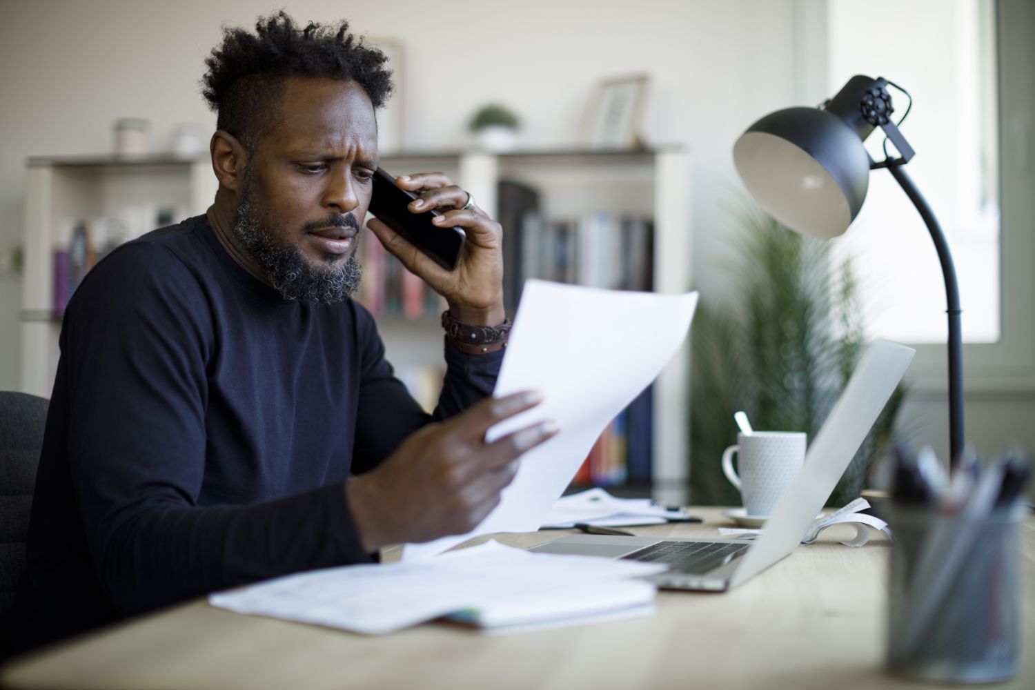A worried man talking on the phone