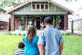 Family in front of a house