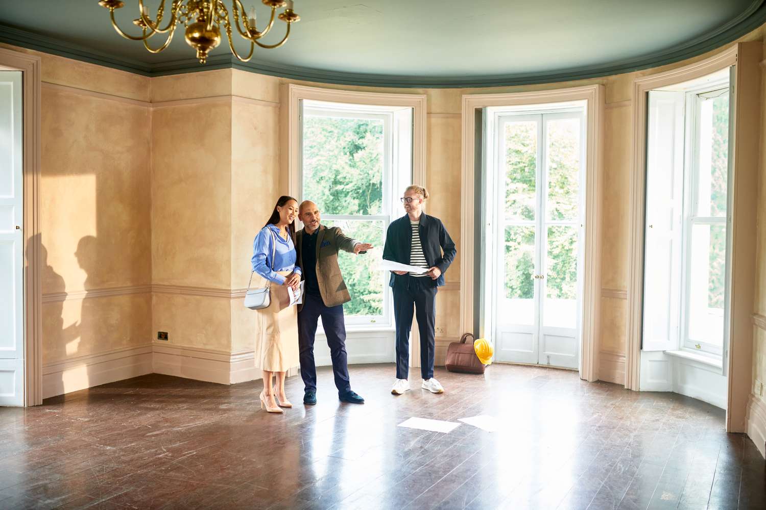 Couple talking with a real estate broker.