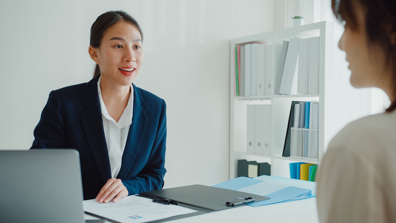 Corporate benefits officer discussing tax-sheltered annuities with employee