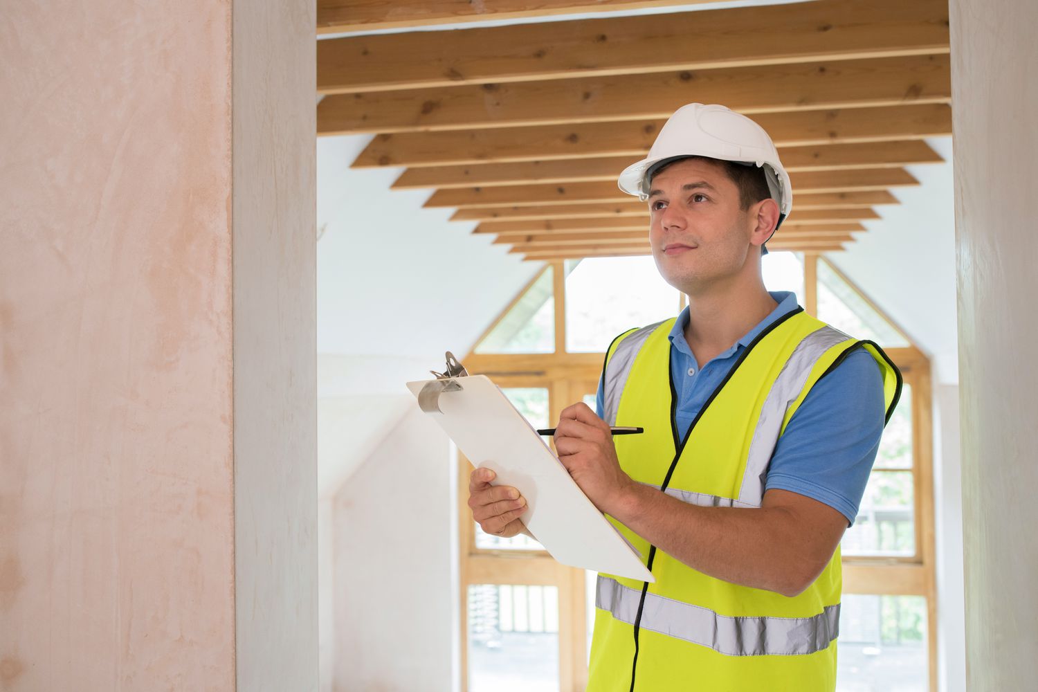 Home inspector checking a new house's condition and systems for upcoming real estate transaction.