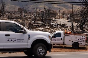 Employees of the Hawaiian Electric restore electric poles in the aftermath of the Maui wildfires in Lahaina, Hawaii on August 16, 2023