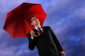 Businessman Holding an Umbrella
