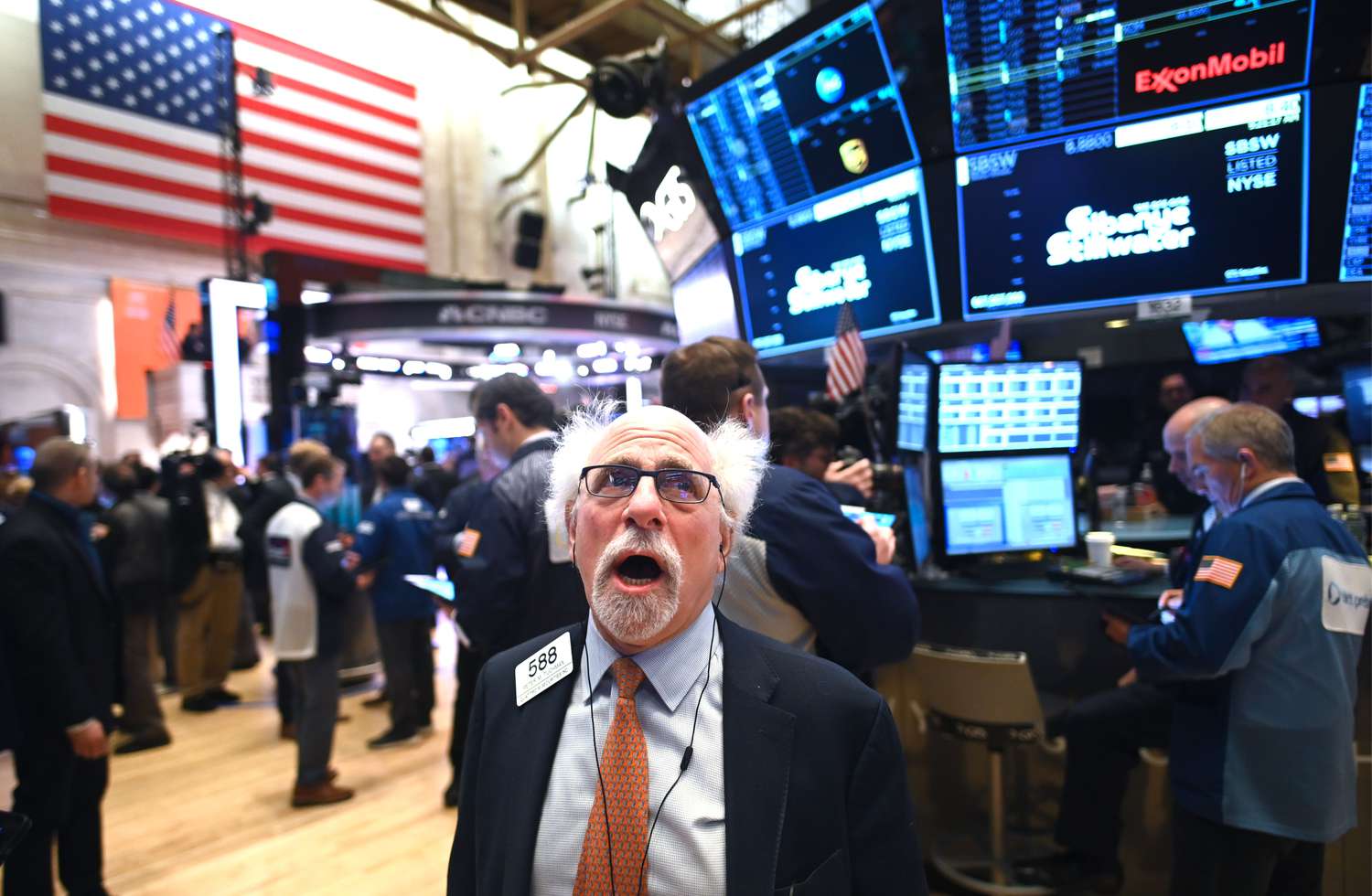 Traders work during the opening bell at the New York Stock Exchange.