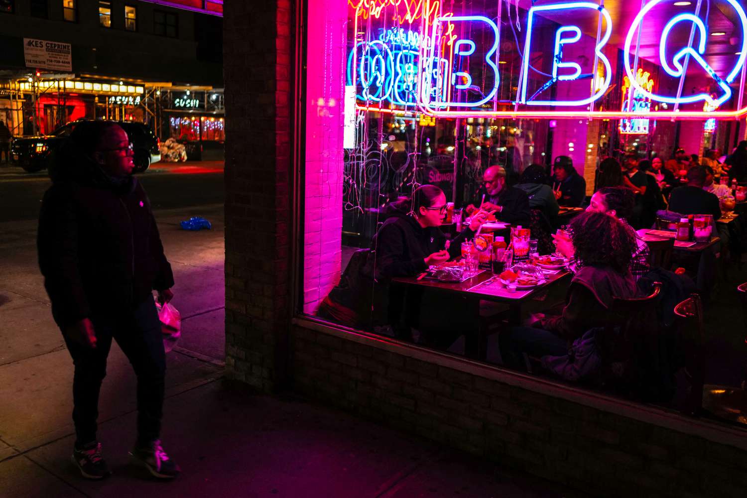 People eat dinner at a barbecue restaurant in the Manhattan borough of New York City on February 16, 2024.