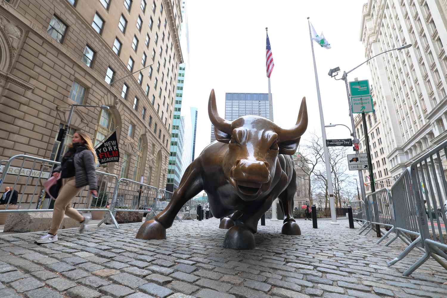 A person walks past the Charging Bull on February 24, 2022 in New York City.
