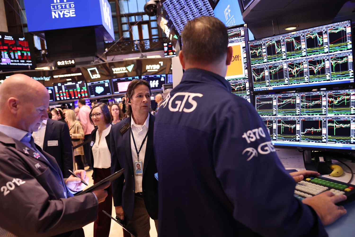 Traders work on the floor of the New York Stock Exchange