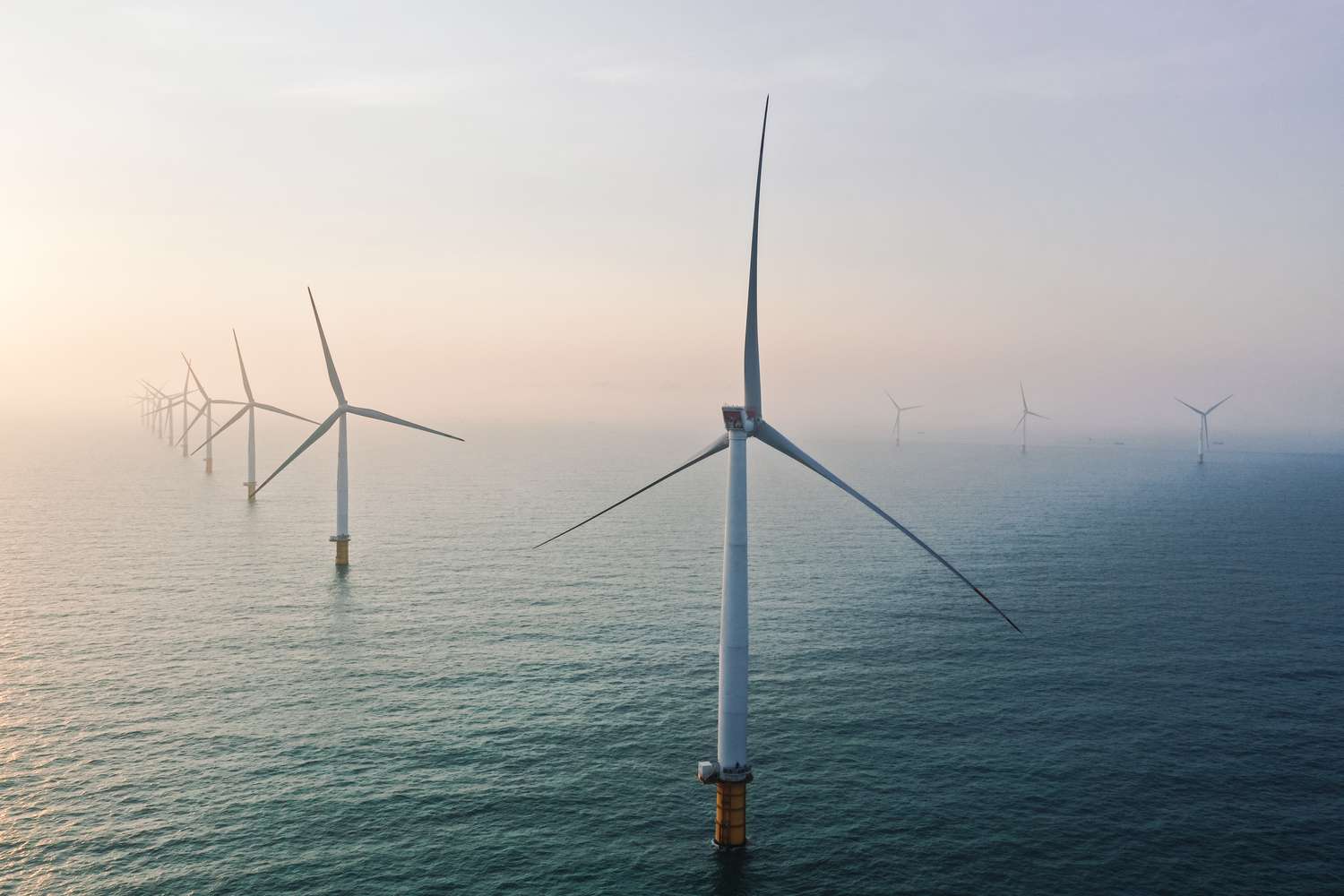 Row of wind turbines in the sea