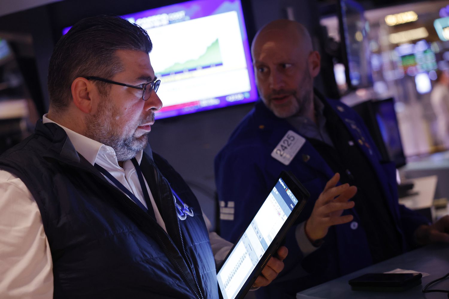 Traders work on the floor of the New York Stock Exchange during morning trading on February 23, 2024 in New York City.