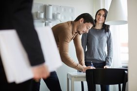 Real estate professionals working on a real estate transaction