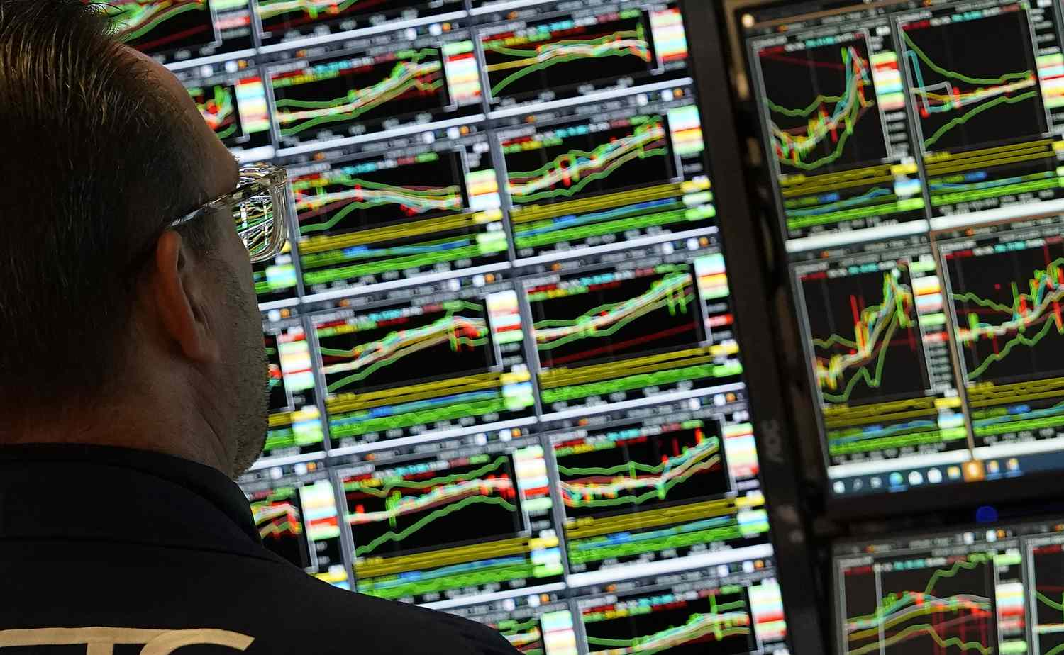 A trader works at his desk on the floor of the New York Stock Exchange 