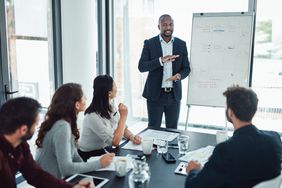 Man presenting at a corporate meeting