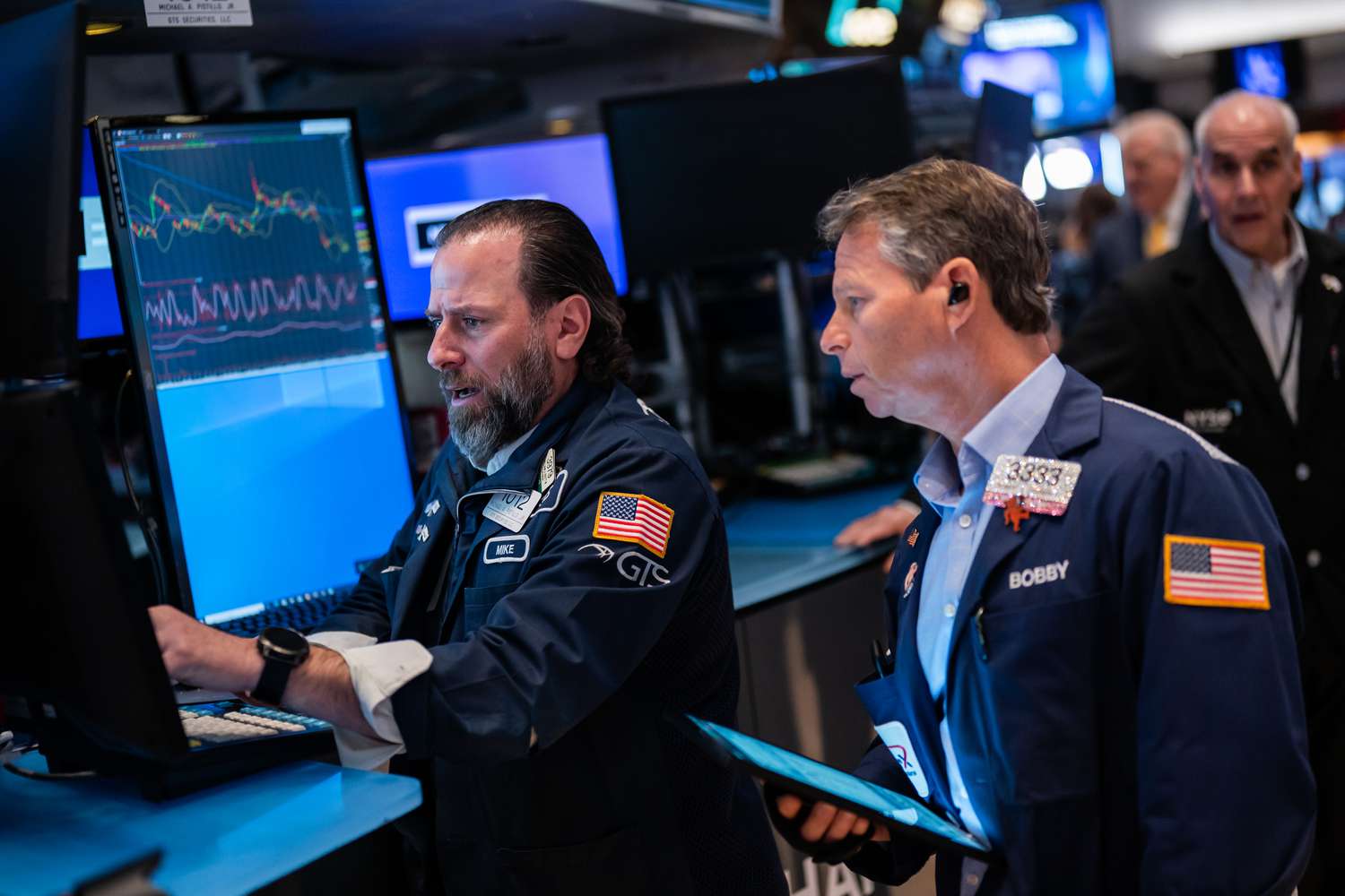 Traders work on the floor of the New York Stock Exchange