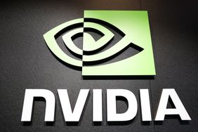 The white and green Nvidia logo is seen on a black wall.