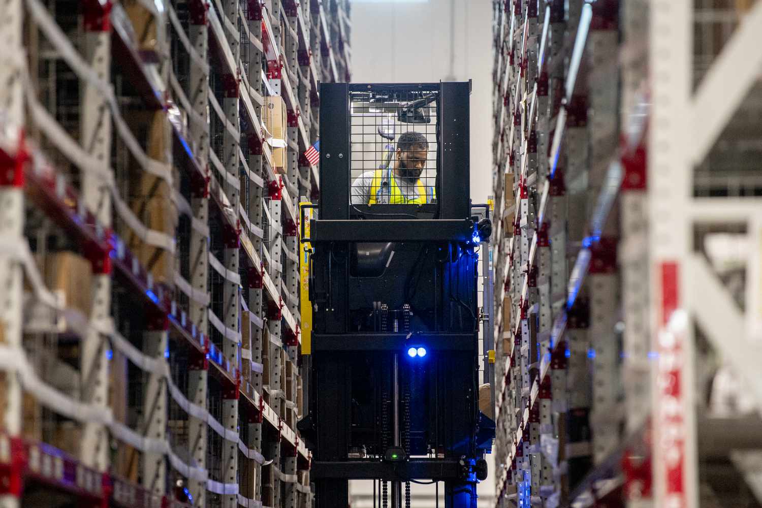 Workers fulfill orders at an Amazon fulfillment center on Prime Day in Melville, New York, US, on Tuesday, July 11, 2023.