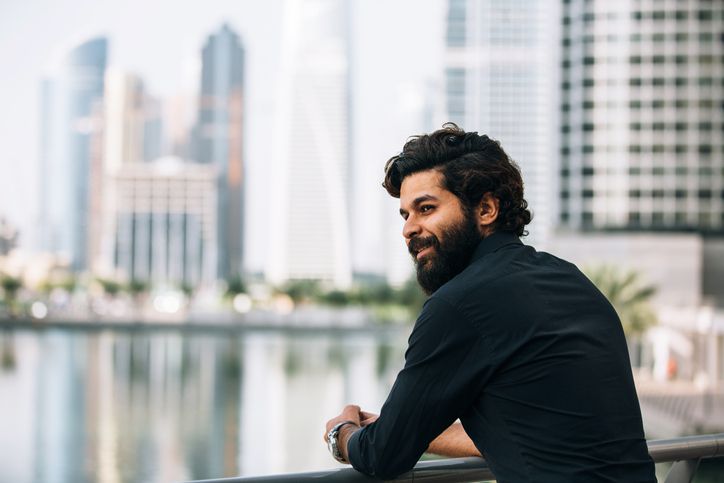 Man looking over balcony
