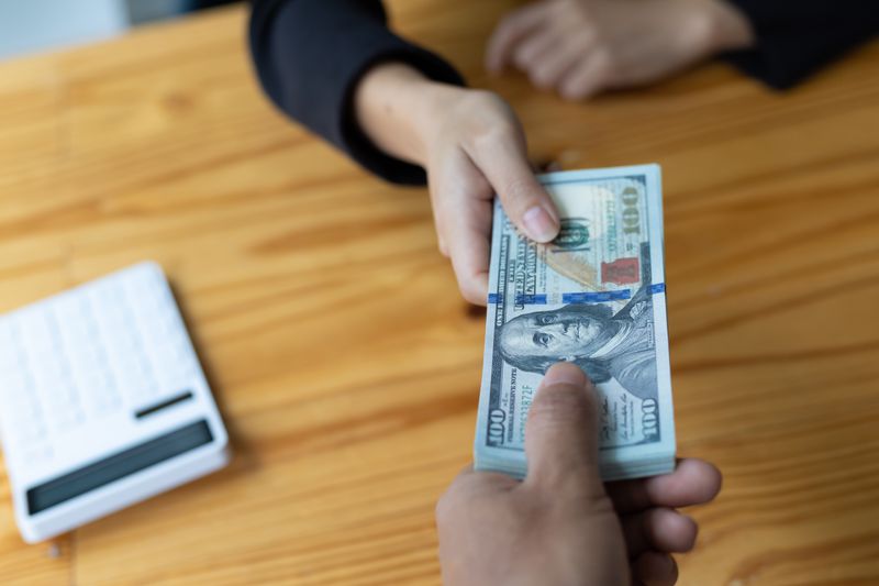 Person making deposit at a bank