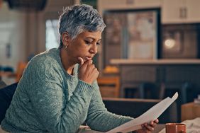A woman reviewing papers