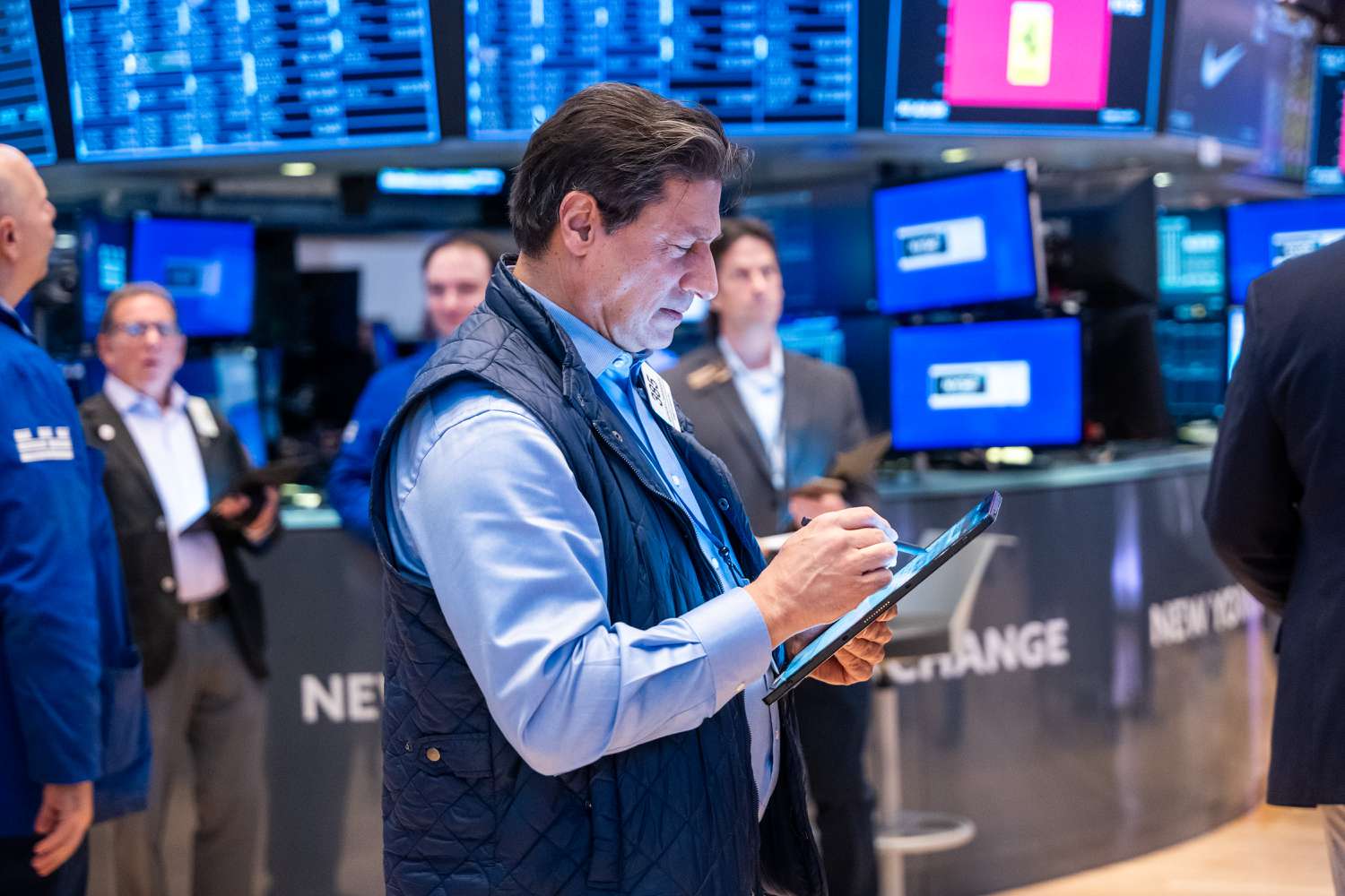 Traders work on the floor of the New York Stock Exchange.