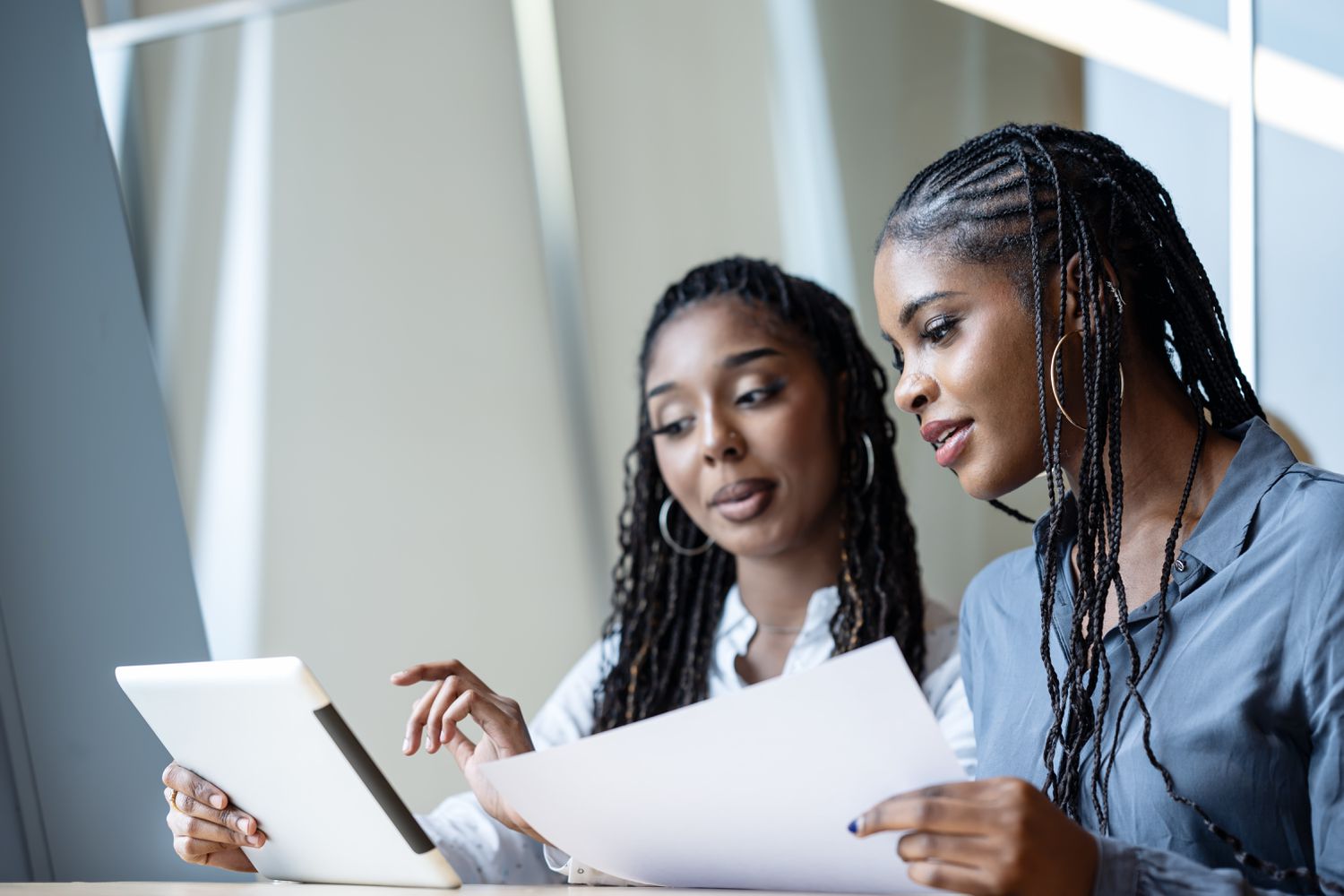 Two colleagues looking at papers 