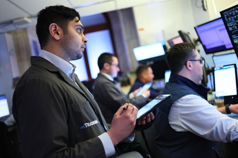 raders work on the floor of the New York Stock Exchange