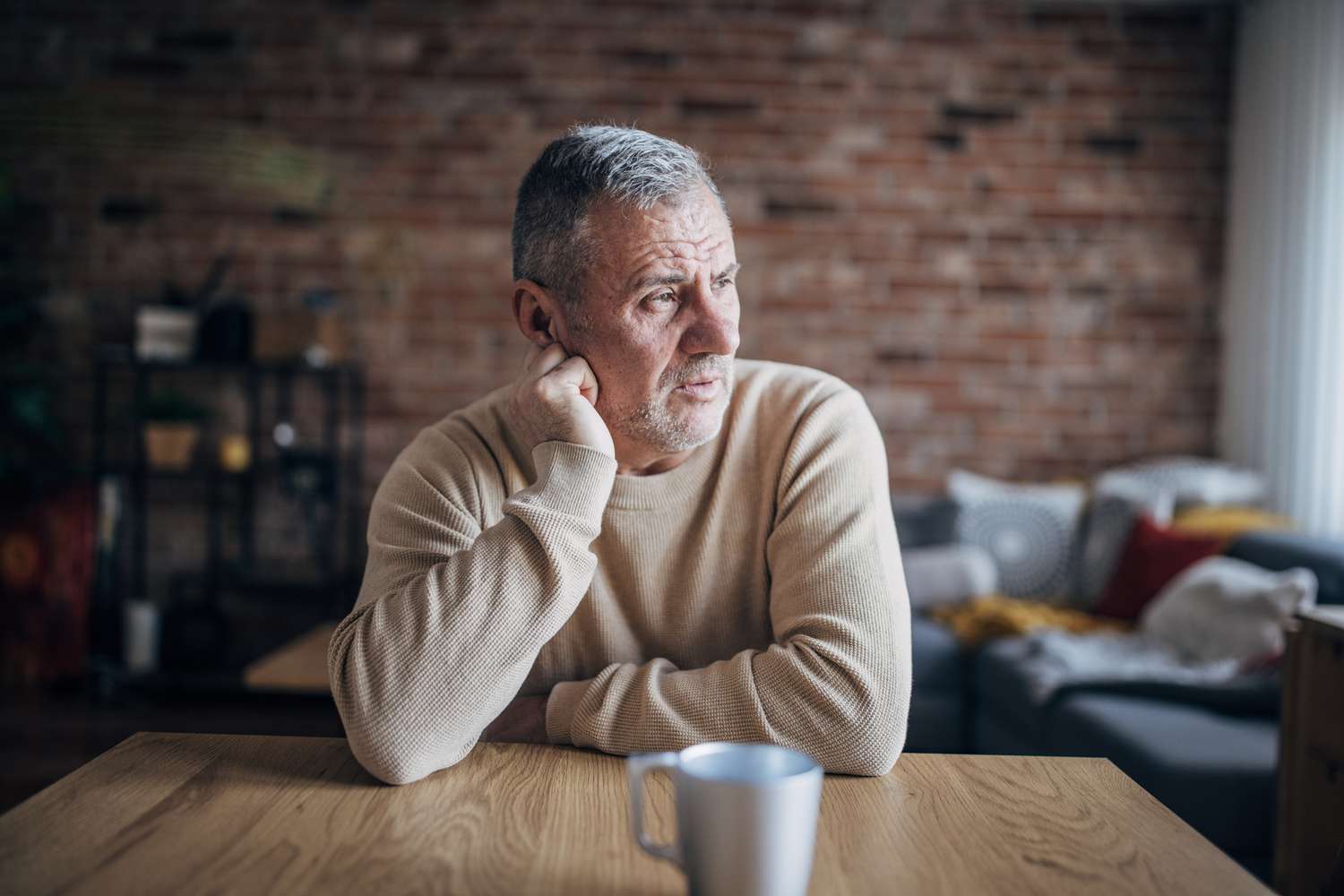 An upset man at a table