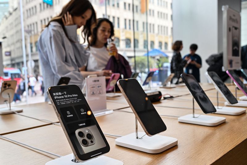 An iPhone 16 display in an Apple store 