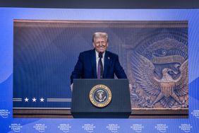 President Trump, seen on a screen at the World Economic Forum in Davos, Switzerland, on Wednesday. 