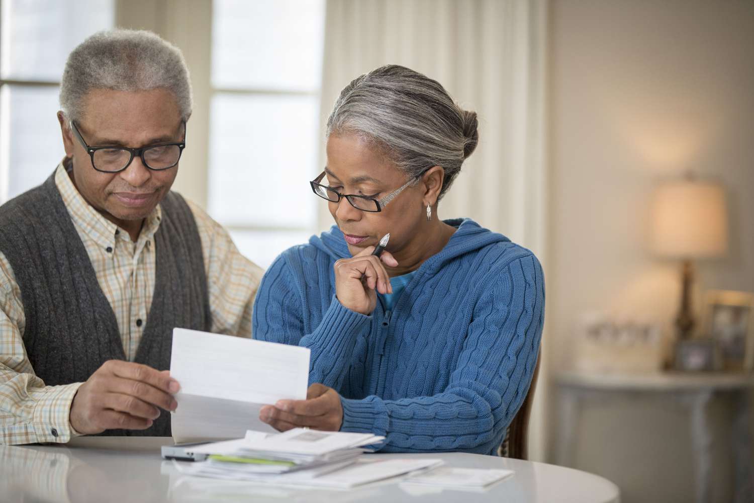 An older couple looks at paperwork
