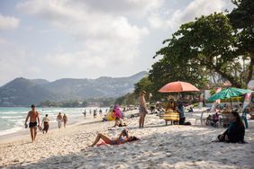 Tourists sunbathe on Chawang Beach, a 7km strip of sand on Samui's eastern coast