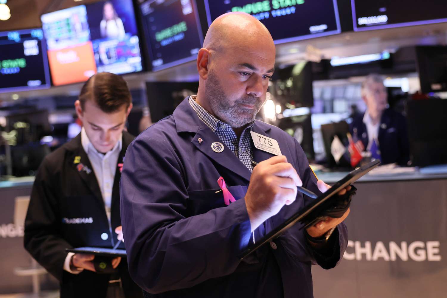 Traders work on the floor of the New York Stock Exchange.